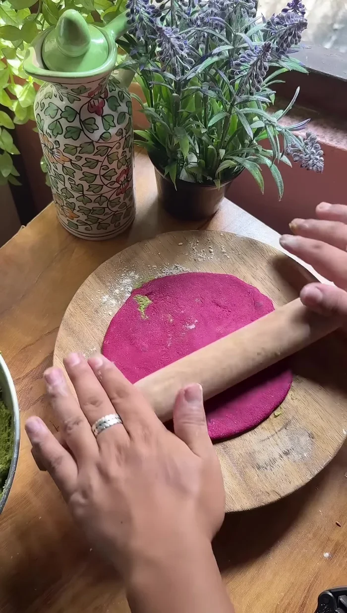 Roll the dough into round paratha shapes.