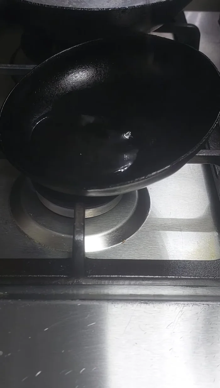 Put a pan on the stove and heat it. Pour in coconut oil.