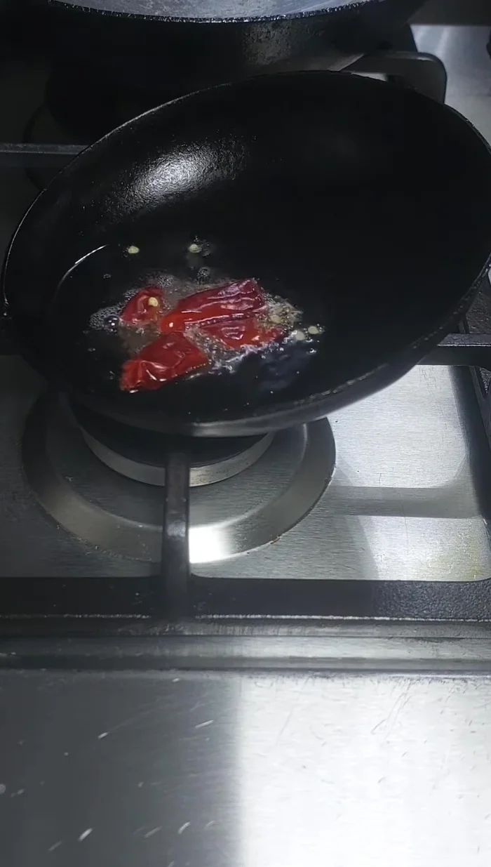 Add pepper powder and reduce flame to low. Cook until the pepper starts to crackle.