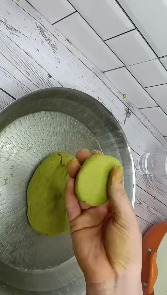 Shape the dough into small balls.