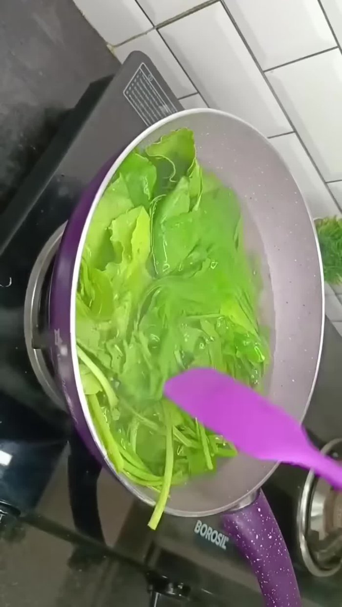 Blanch spinach in hot water for 2 minutes, then immediately plunge into cold water.