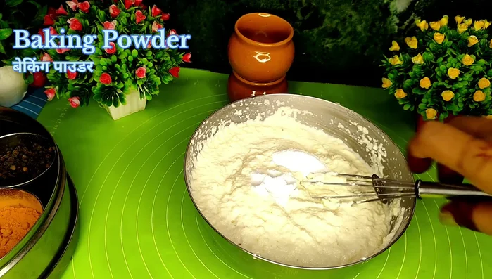 After resting, add baking powder and baking soda (or Eno) to the batter and mix well (155.76).