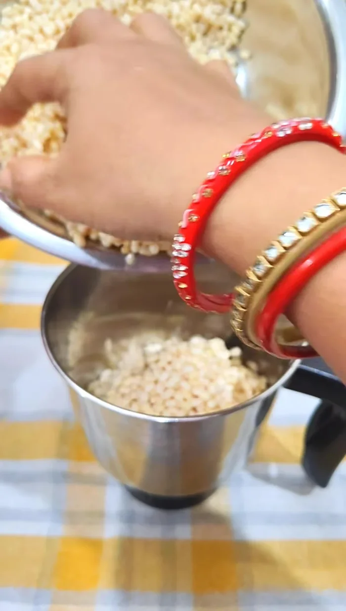 Grind half the soaked urad dal in a mixer with enough water to make a fine paste. Repeat with the remaining urad dal.