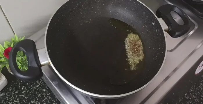 Add chopped tomatoes, turmeric powder, salt, and cook for 2-3 minutes.