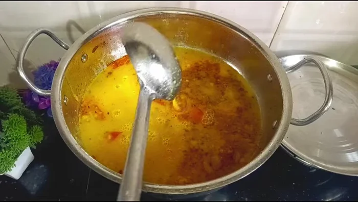 Add the cooked arhar dal to the seasoning and mix well.