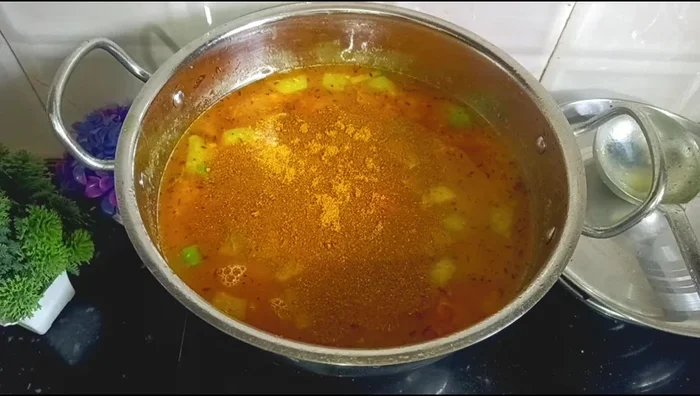 Add sambar masala, tamarind water, and jaggery. Cook until boiling.