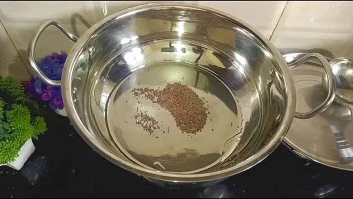Prepare sambar seasoning: Heat oil in a pan, add mustard and cumin seeds, then sliced onion until light golden.