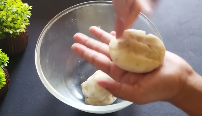Divide the dough into portions and roll out each portion very thinly. Apply dry flour to prevent sticking.
