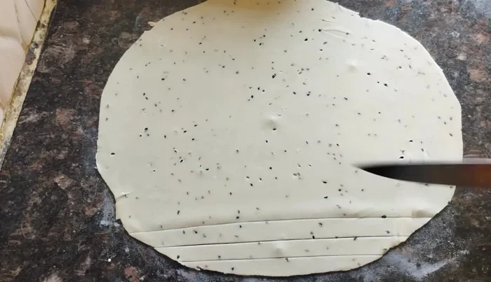Cut the dough into desired shapes (long strips, diamonds, squares, etc.).