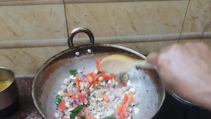 Add chopped tomatoes and salt. Cook until the tomatoes are softened.