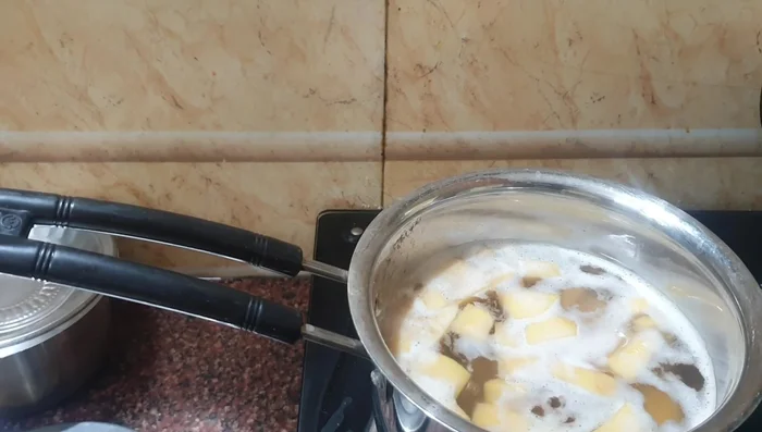Boil the yam until it's about 80% cooked, adding a pinch of turmeric powder and salt.