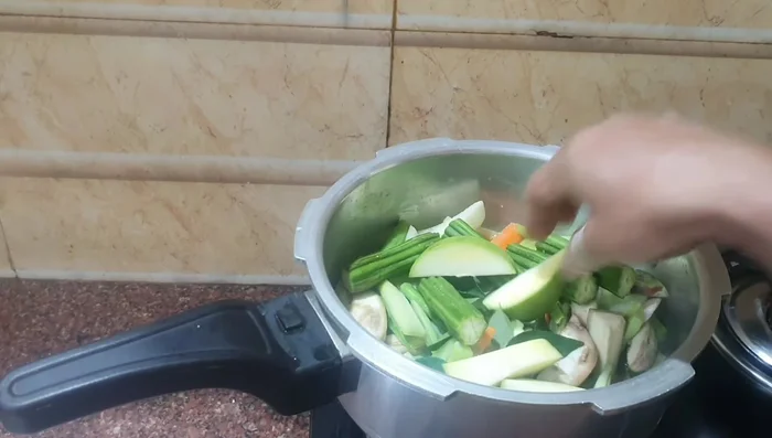 Add mango pieces. Cook until the cooker whistles. (117.28)