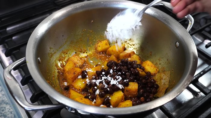 Soak 1/3 cup of kala chana (black chickpeas) in water overnight. Discard the water the next day and pressure cook the chickpeas in 1 cup of water for 20 minutes. Allow the pressure to release naturally before opening the lid.