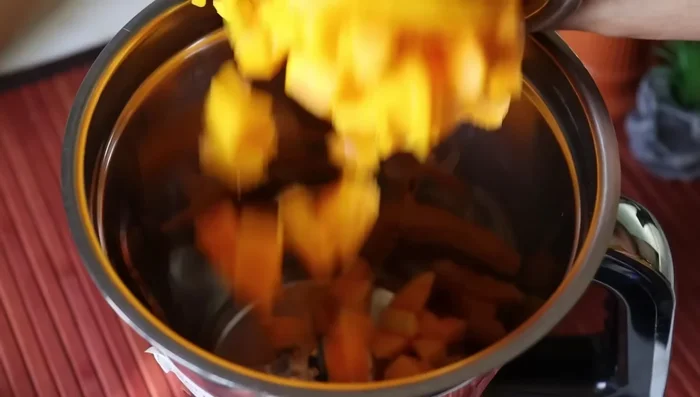 Add 1 cup of finely chopped ripe mangoes to a mixer jar.