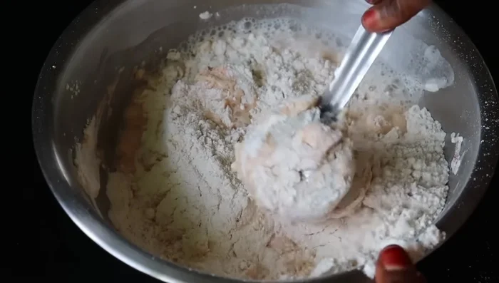 Gradually add water and knead into a soft, pliable dough.