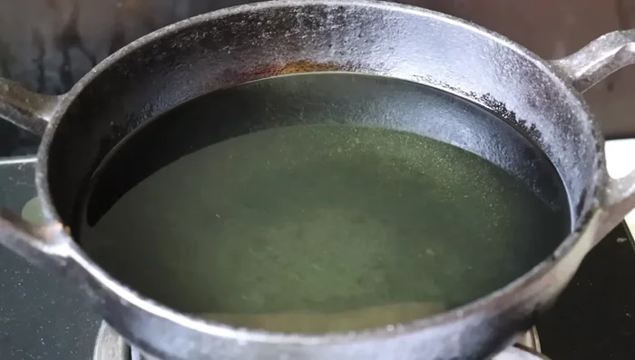 Heat oil in a pan over medium heat.