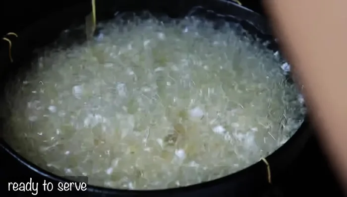 Remove the fried Oma pieces and place them on a plate to cool.