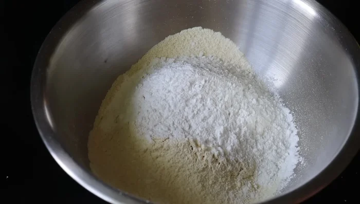 Add 2 cups of fine rice flour (using the same cup as for peanuts).