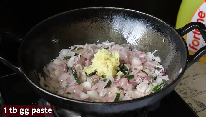Add ginger-garlic paste and saute until the raw smell disappears.