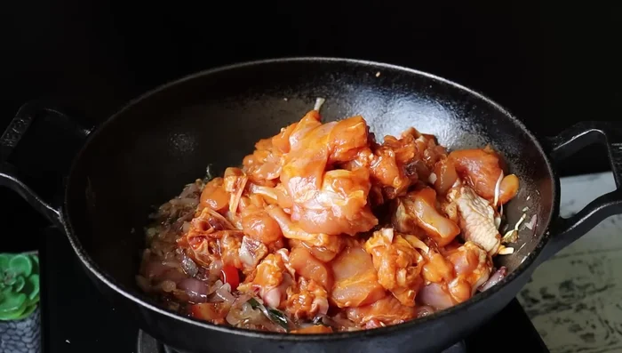 Add the marinated chicken and mix well. Cook for a minute or two.