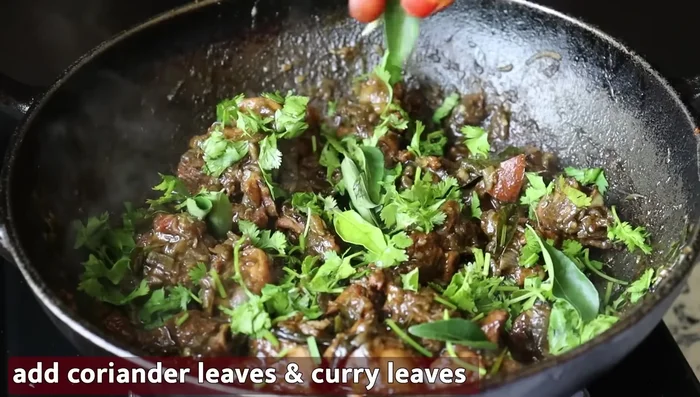Garnish with coriander leaves and bay leaves before serving.
