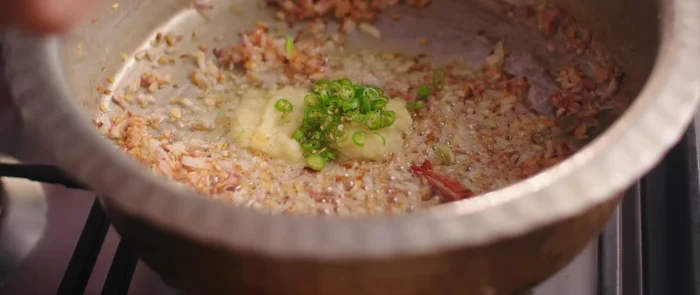 Add ginger-garlic paste and green chilies. Fry briefly.