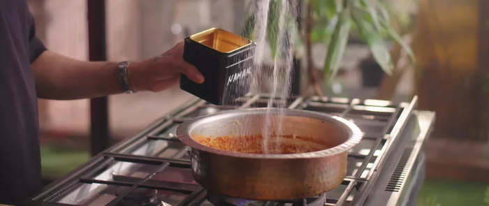 Add the tomato-cashew puree, salt, and cook until tomatoes are softened. Adjust consistency with water as needed.