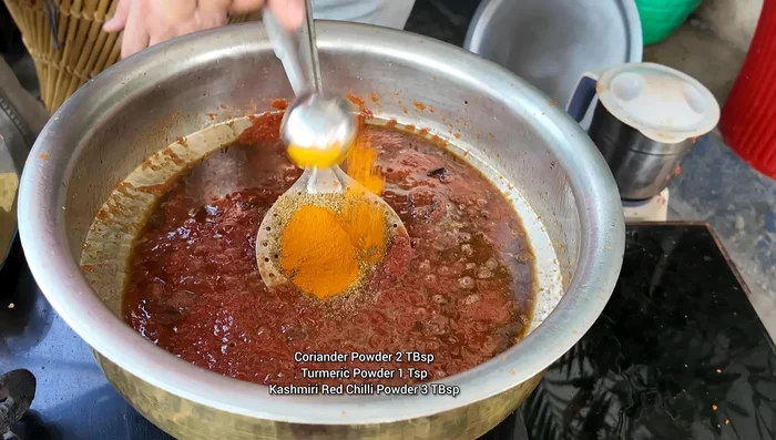 Add coriander powder, turmeric powder, chili powder, and fennel powder. Mix well.