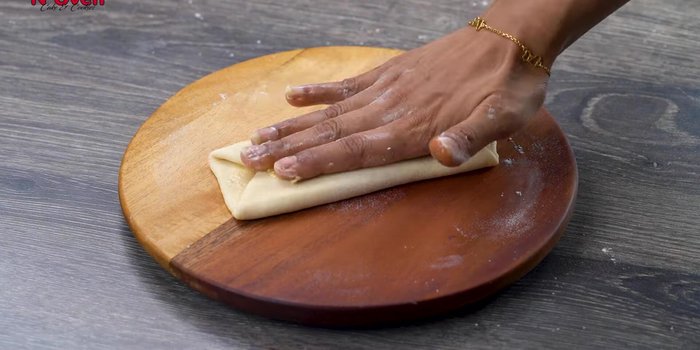 Roll again into a layered paratha. Use ghee for rolling.
