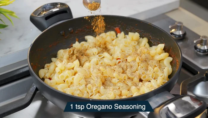Season with black pepper, oregano, and garam masala (optional). Mix thoroughly.