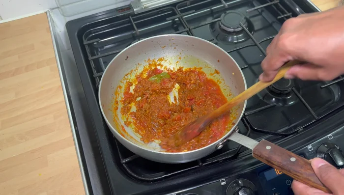 Add chopped tomatoes and cook for 5-8 minutes until the oil separates.