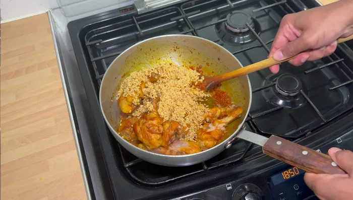 Return the chicken to the pan. Add the soaked moong dal and cook for a few minutes before adding 3 cups of water.
