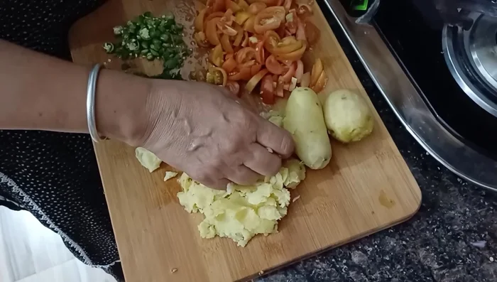 Add chopped onions and sauté until slightly reddish.