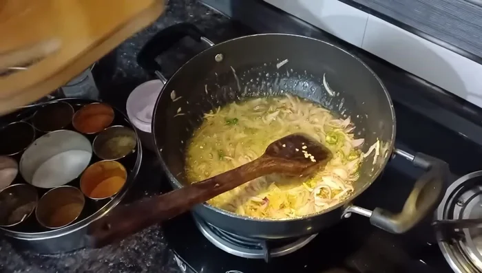 Add green chilies, turmeric, and a little salt.