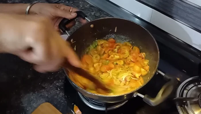 Cover and cook until tomatoes are mashed well.