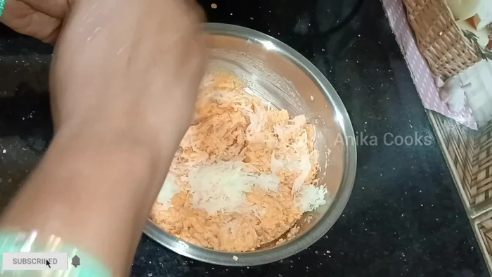 Add the grated potatoes to the moong dal batter and mix well.