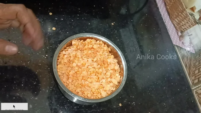 Grind the moong dal in a grinder without adding water until smooth.