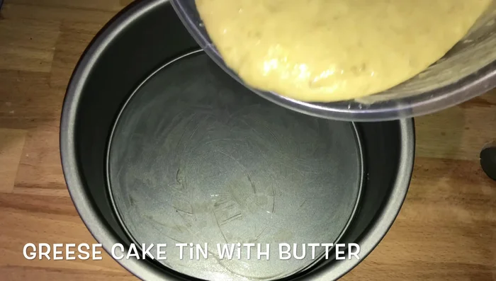 Pour batter into a greased baking pan.