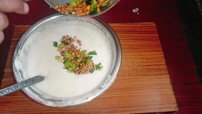 Mix the cooled dal mixture into the fermented idli batter. Add salt to taste.