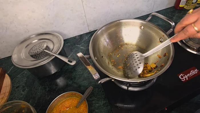 Remove the bhujia. Fry the eggs in the same pan.