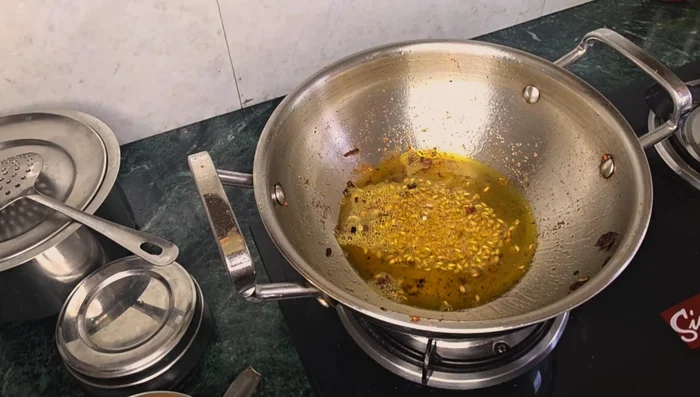 Add oil to the pan and add cumin seeds.