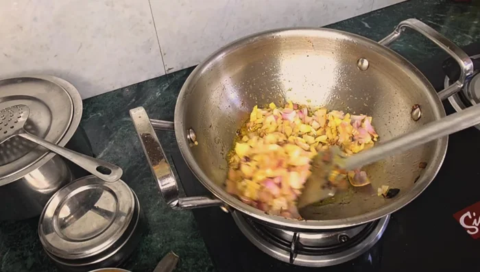 Add finely chopped onions and fry until brown.