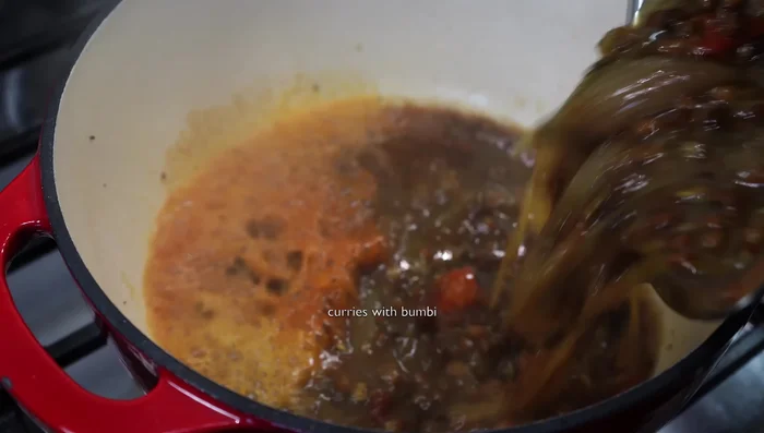 Add Kashmir chili powder and asafoetida. Add the cooked lentils.