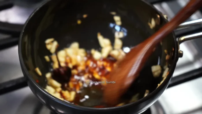 Add Kashmir chili powder (off the heat). Add this mixture to the dal.