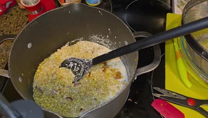 Add vegetable broth, and a bay leaf.