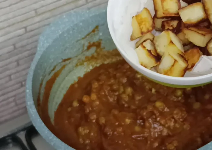 Add the fried paneer cubes and mix. Cover and simmer for 10 minutes, stirring halfway through.