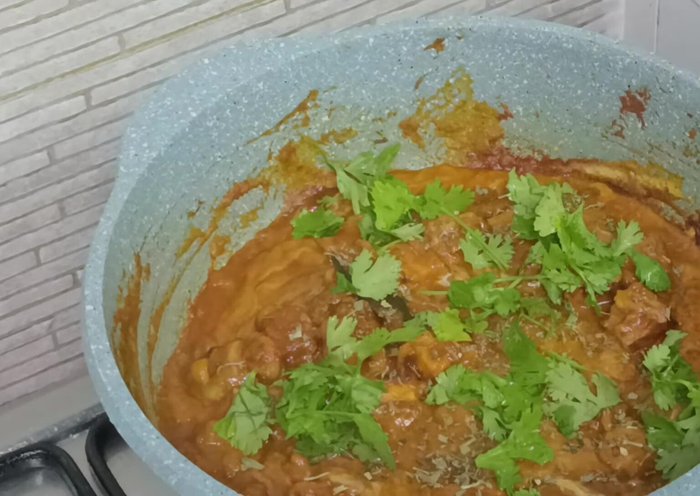 Serve hot with chapatis, fried rice, or batura.
