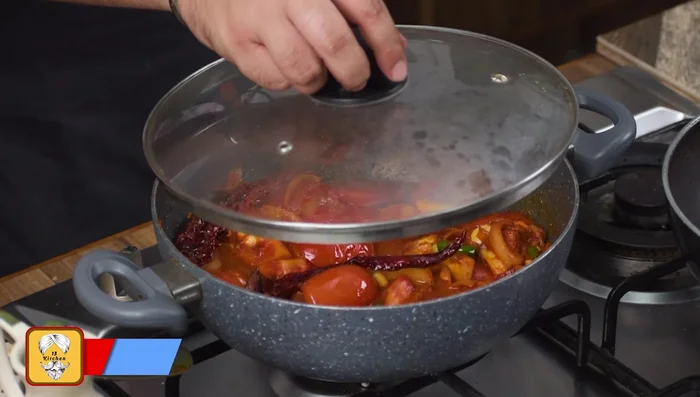 Add water, cover, and cook the makhani gravy until the vegetables are soft.