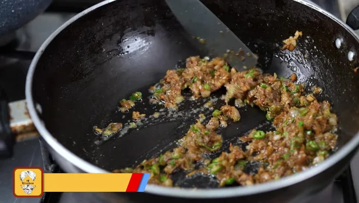 Add a little water to help the onions melt. Cook until the onion bite is gone. This is the chop masala.