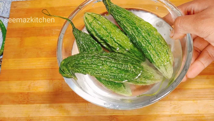Add lemon and ghee. Prepare the dough without adding water, as cucumber contains moisture.